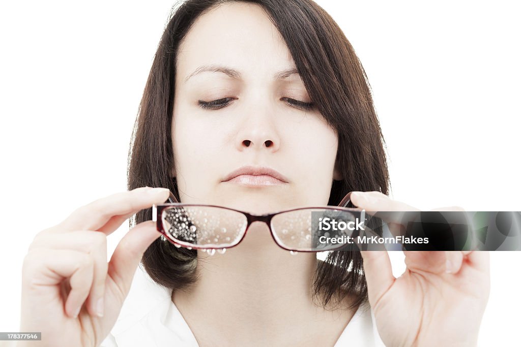 Woman with Wet Glasses Serious Brunette Woman Holding Wet Glasses 20-29 Years Stock Photo