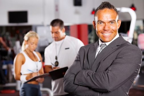 confident male gym manager portrait