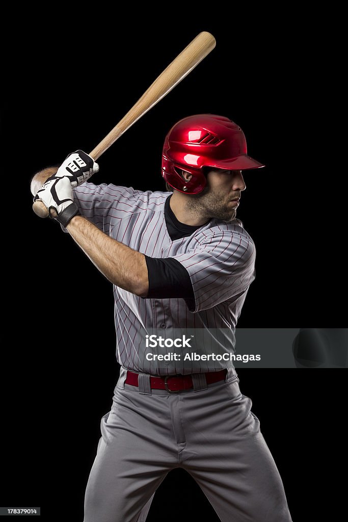 Baseball Player Baseball Player ready to swing, on a black background. Studio Shot. Baseball Player Stock Photo