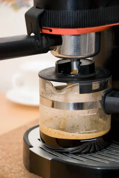 Making hot coffee in a coffee-machine