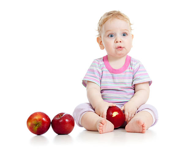 istock kid eating healthy food isolated 178379587