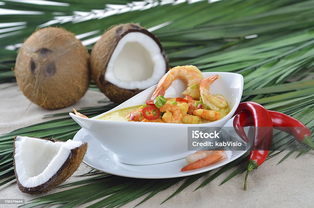 Shrimps soup Hot coconut prawn soup with chili and curry Coconut Stock Photo