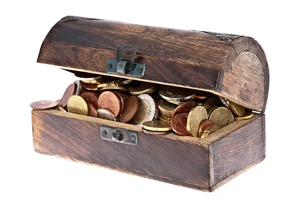 Treasure box filled with Euro-Coins isolated on white background