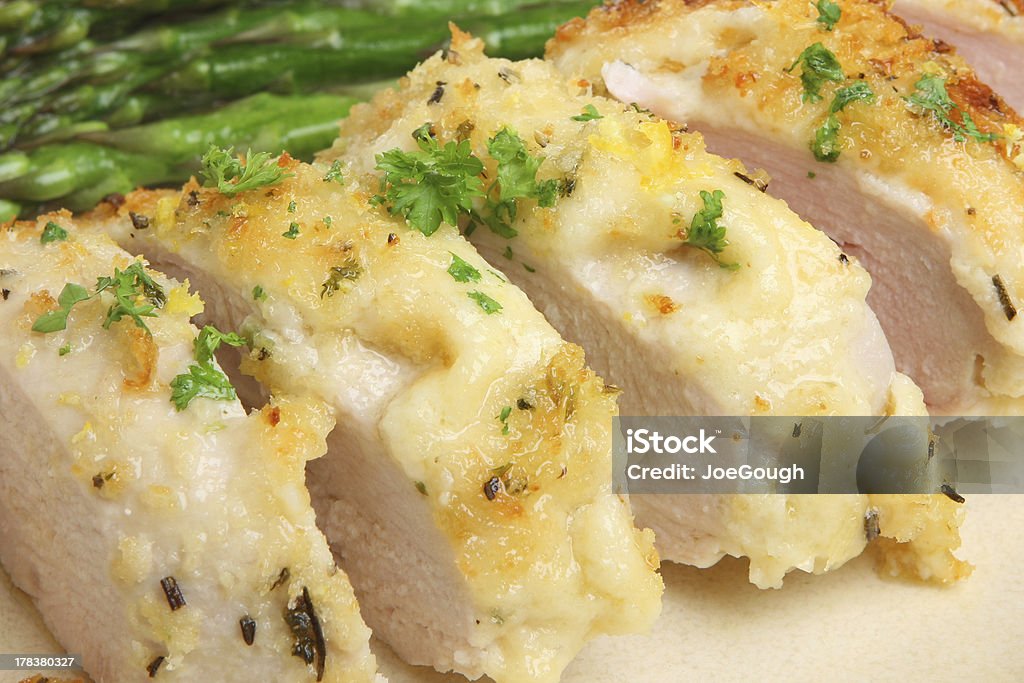 Italian Baked Chicken with Lemon, Cheese and Herbs "Chicken baked with Parmesan cheese, breadcrumbs, lemon and herbs" Asparagus Stock Photo