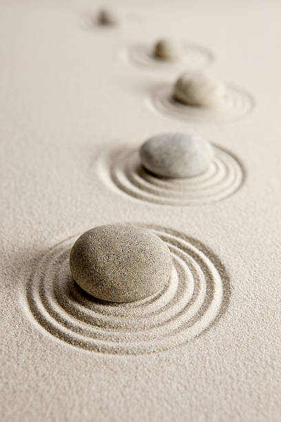 istock Stones in a line in the sand in a pattern 178380825