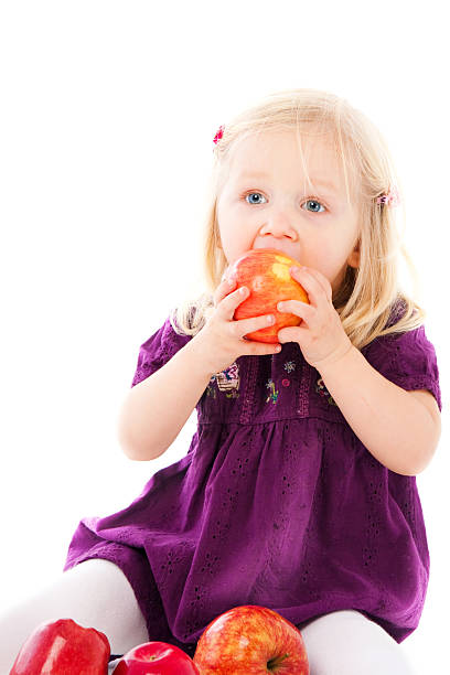 istock The lovely girl with apples 178380843