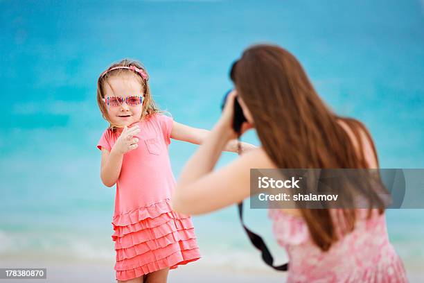 A Little Girl Posing For Her Mom For A Picture At The Beach Stock Photo - Download Image Now