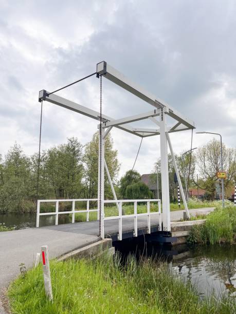 istock a boat is sitting on a bridge over water and grass 1783812195