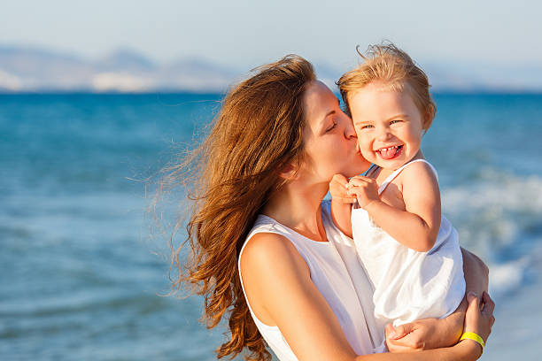 istock Mother and daughter on the beach 178381870