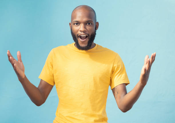 istock Portrait, wow and surprise with a black man in studio on a blue background feeling shocked or in awe. Announcement, news or gesture and a surprised male looking on in wonder with an omg expression 1783819625