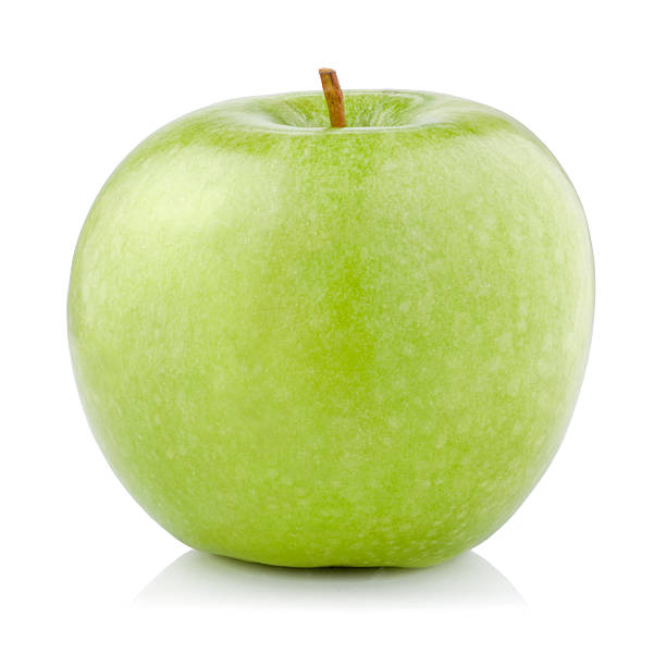 mela verde singolo isolato su sfondo bianco - mature women isolated mature adult women foto e immagini stock