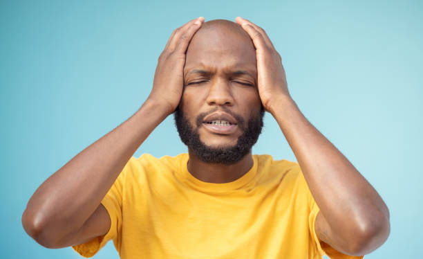 istock Fail, mistake and mental health with a black man in studio on a blue background feeling stress or anxiety. Compliance, burnout and oops with a handsome young man posing hands on head on a pastel wall 1783820809