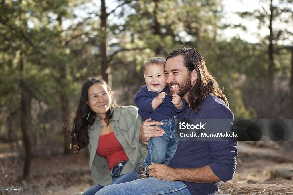 Family enjoying a day in nature "Young family enjoying a day in nature, shallow DOF, father and son in focus" Indigenous Peoples of the Americas Stock Photo