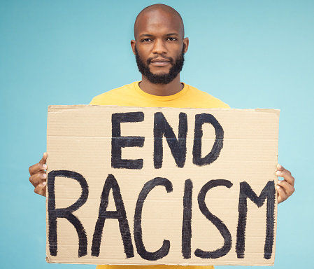 End racism poster, black man and protest isolated on blue background for social justice, change and equality problem. Youth, fight and cardboard sign for human rights, politics and person portrait