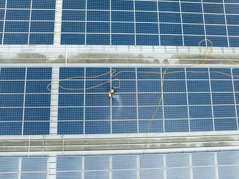 Solar system as modern lifestyle. Large photovoltaic panels working at sunny day. Saving nature with your own benefit.