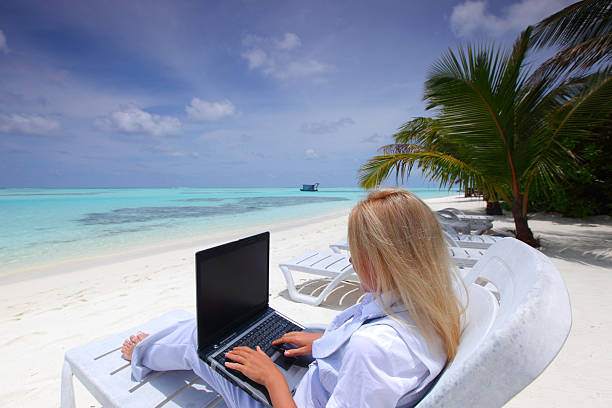 istock tropical business woman with laptop 178383023