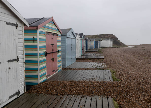 istock Colourful beach huts in winter rain 1783831271
