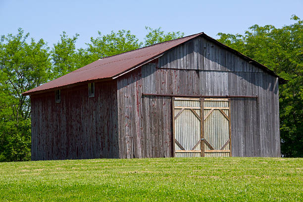 Old wood Barn frmed in green stock photo