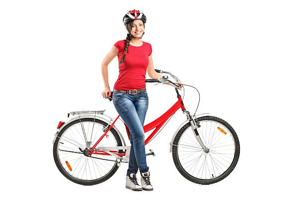 istock Smiling female posing next to a bicycle 178383544