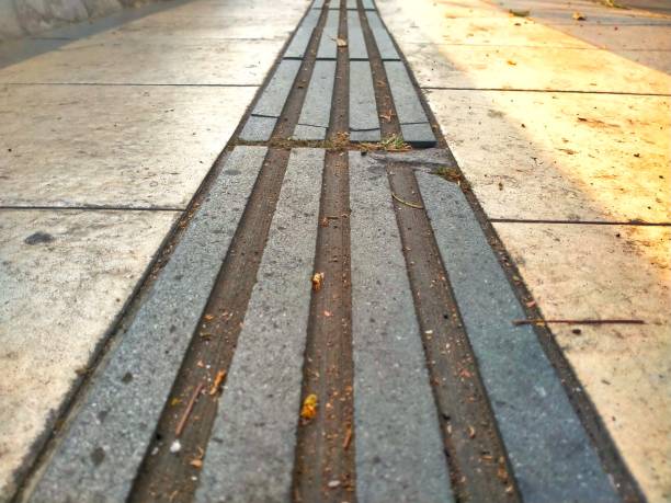 Tiles guide for the blind on the sidewalk