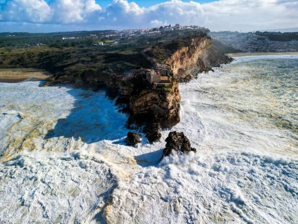 istock waves crash against a rocky beach and shoreline on a sunny day 1783838311