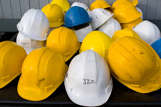 istock pile of hard hats 178383983