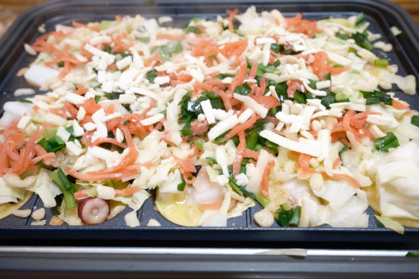 istock A takoyaki maker that warms takoyaki ingredients 1783840554