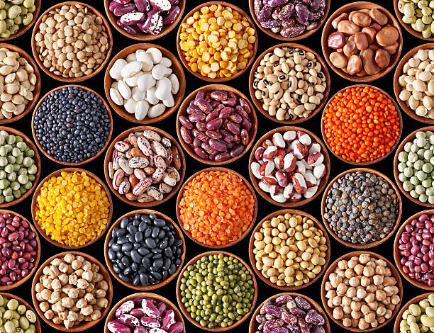 Seamless texture with legumes Seamless texture with legumes on black background bean stock pictures, royalty-free photos & images