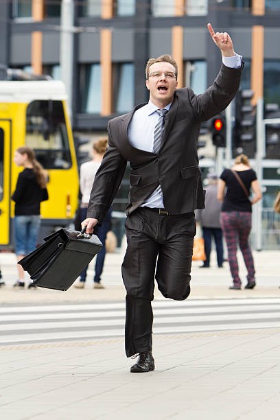 istock Businessman running through the streets 178384451