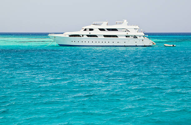 istock white yacht in blue sea 178384470