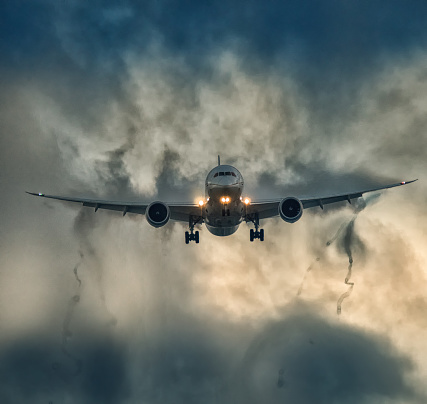 salvador, bahia, brazil - may 3, 2013: Boeing 737 of the airline Gol goes through a rain cloud during the landing procedure at the airport in the city of Salvador.