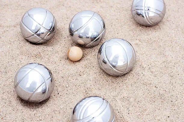 "Game of jeu de boule, silver metal balls in sand. A french ball game"