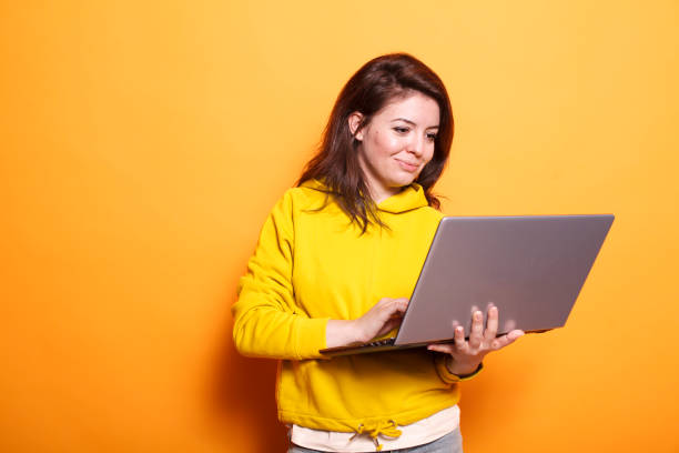 istock Modern woman holding digital laptop 1783848513