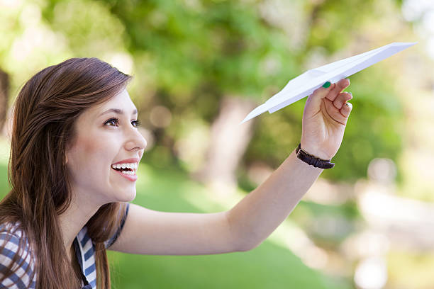 istock Young woman with paper plane 178385268
