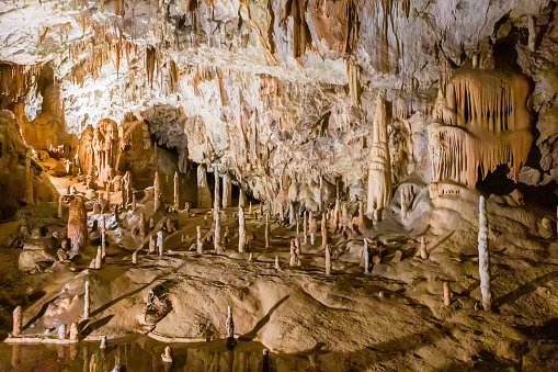 Postojna, Slovenia - June 27, 2023: Exploring beautiful Postojna cave in Slovenia the most visited european cave. Thousands of stalagmites and stalactites