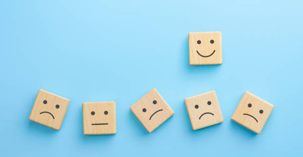 istock Wooden blocks with the happy face smile face symbol on blue background, evaluation, Increase rating, Customer experience, satisfaction and best excellent services rating concept 1783854885