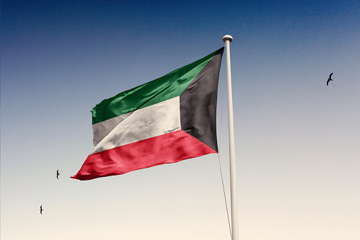 Kuwait flag isolated on the sky with clipping path.