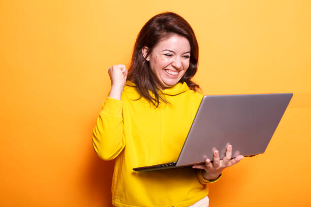 istock Excited lady holding her digital laptop 1783859350