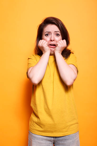 istock Brunette lady looks afraid and emotional 1783860508