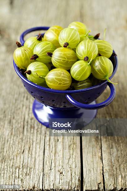 Fresh Gooseberries In Blue Colander Stock Photo - Download Image Now - Backgrounds, Berry Fruit, Blue