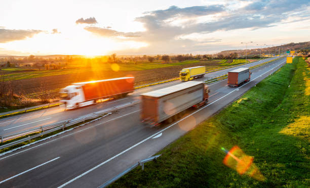 istock Fast blurred highway traffic with transportation trucks 1783863293