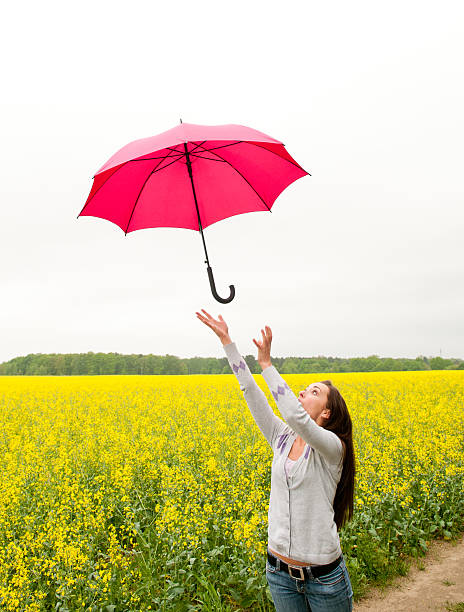 istock woman with red umbrella 178386493