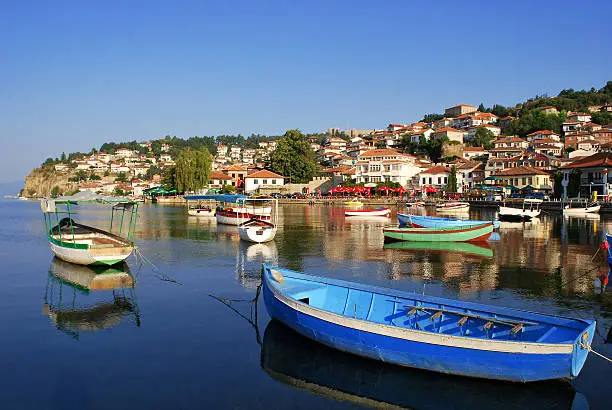 Fishing boats with the view of an old town of Ohrid in the background
