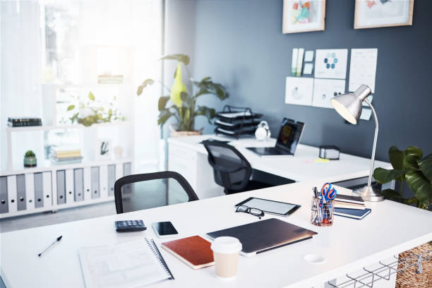 istock Empty office, interior and business with table, professional layout and desk in startup agency. Background of modern workplace, building and furniture in company, workspace and setup in bright room 1783866335
