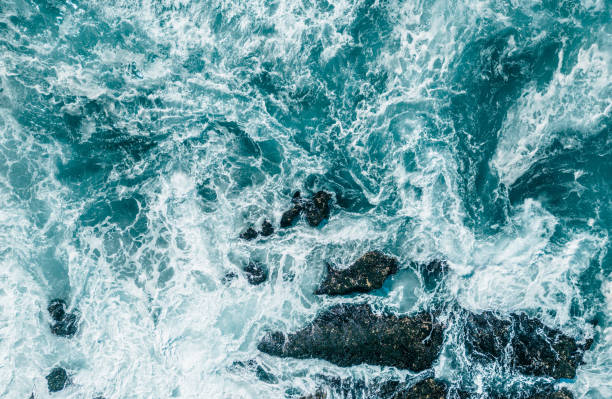 istock Large waves of turquoise rough sea from above 1783867407
