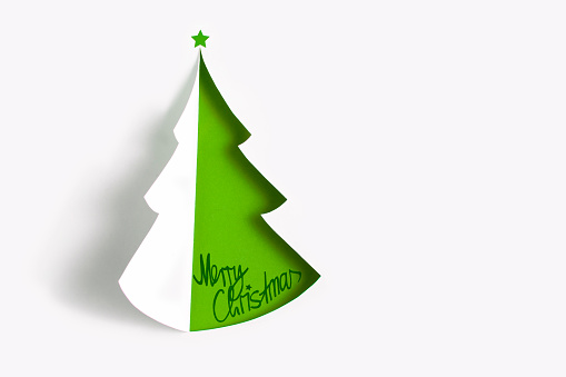 Christmas tree made of paper for winter and holiday concept