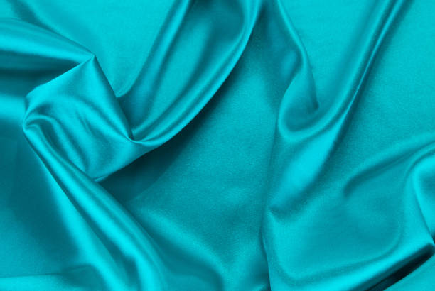 istock Soft folds of light blue silk texture. Whole background. 1783869152