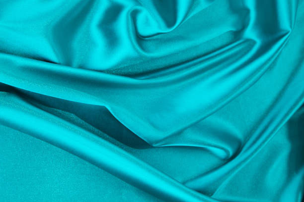 istock Soft folds of light blue silk texture. Whole background. 1783869707