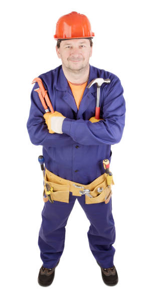 istock A worker in hard hat hold a hammer and an adjustable wrench. 1783869738