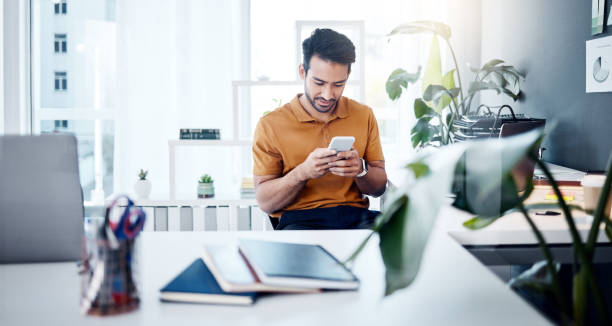 istock Man with smile, phone and typing in modern office, checking social media meme or email. Happiness, internet and mobile app, creative designer at start up agency reading web review or feedback online. 1783871565